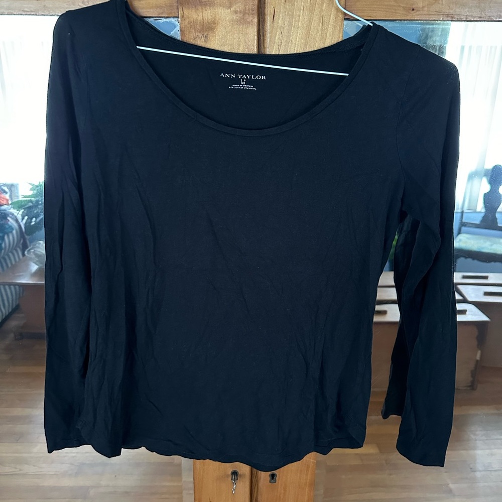 Ann Taylor black tee shirt. Three quarter sleeves. Rounded hem.  Size medium.